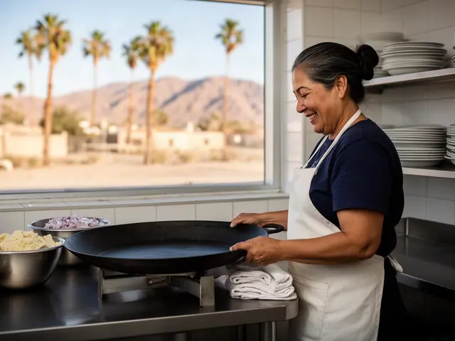 A woman with dark hair in a low bun beside new equipment in a small family tortilleria and taqueria.
